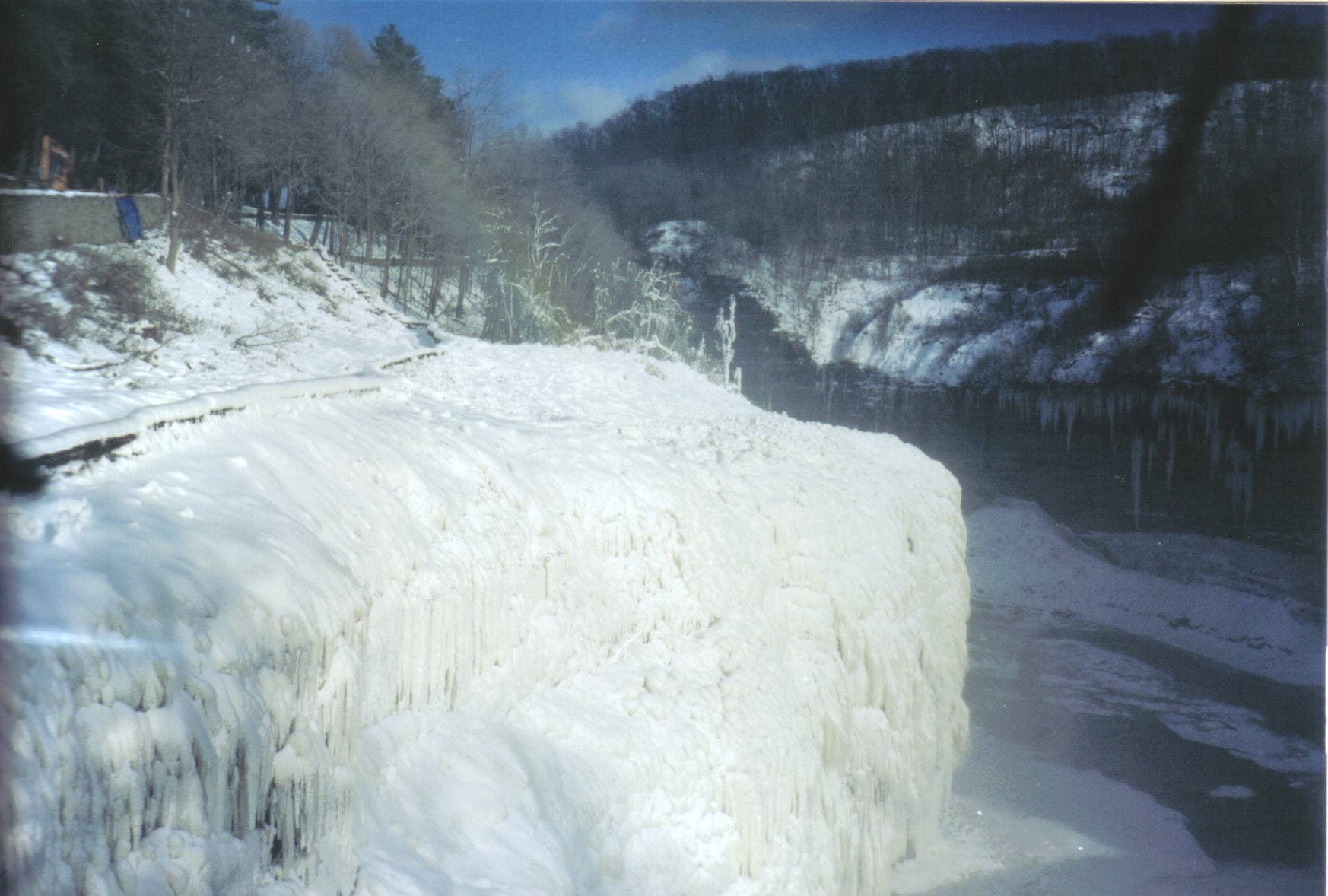 The gorge cliffs downstream of Middle Falls at Letchworth State Park covered in winter snow